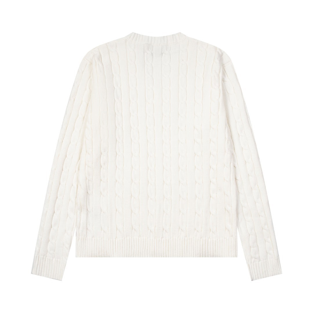 V-neck knitted sweater with twist embroidery